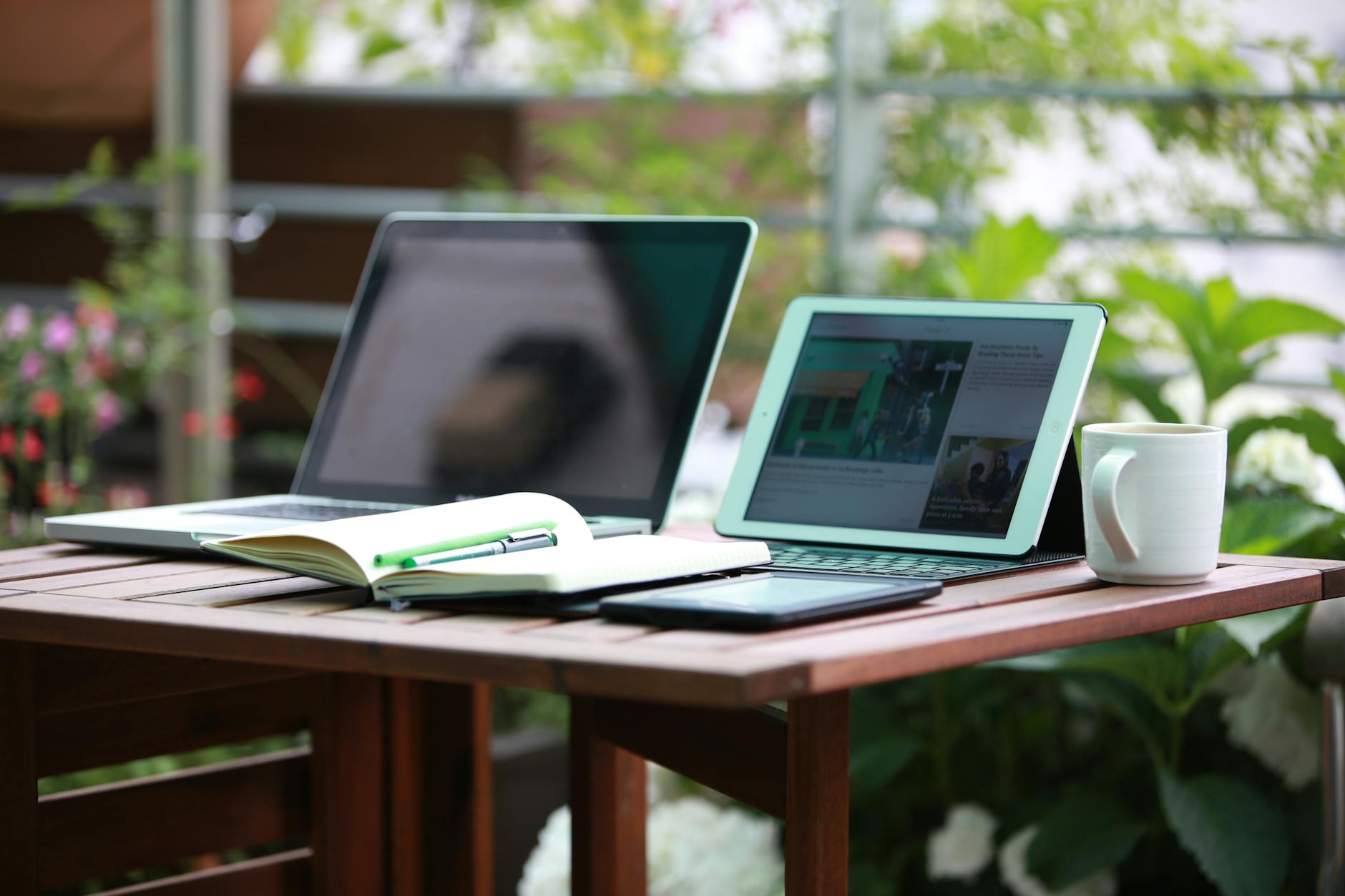 two black laptop computers turned on